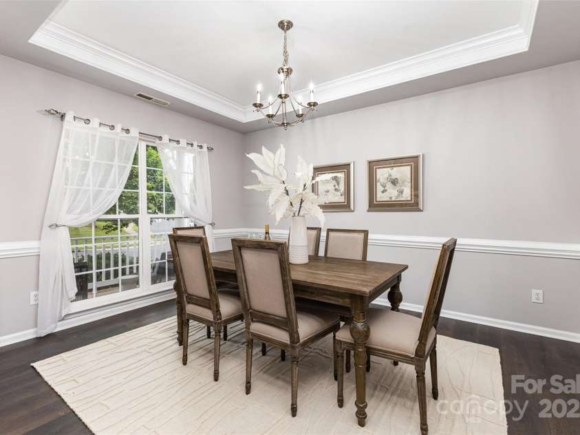 10198 Tintinhull Drive, Indian Land, SC 29707.  MLS# CAR4265539, YatesRealty ID 25357. Just to the left of the front door is the Formal DR, accented with chair & crown moldings, and tray ceiling.