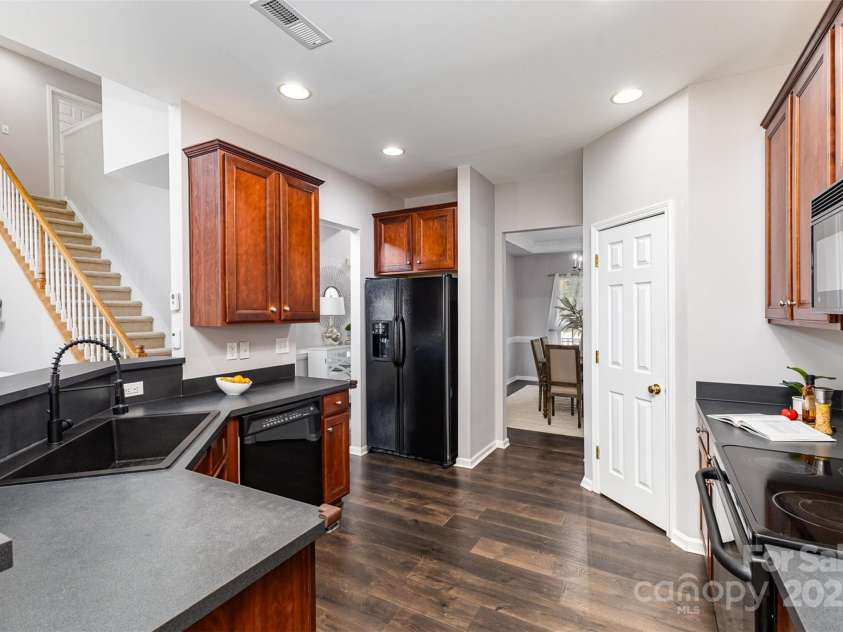 10198 Tintinhull Drive, Indian Land, SC 29707.  MLS# CAR4265539, YatesRealty ID 25357. Kitchen is perfectly located just off the Formal DR and the Great room! Newer LVP installed in 2021.