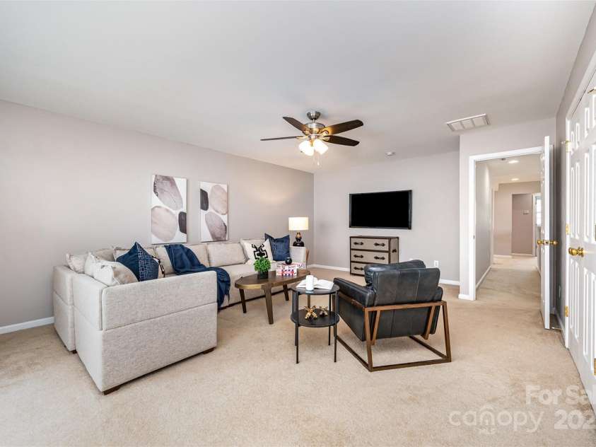 10198 Tintinhull Drive, Indian Land, SC 29707.  MLS# CAR4265539, YatesRealty ID 25357. The bonus/bedroom with 2 double door closets, showing the hallway to the other secondary BR's & Full Bathroom on upper level.