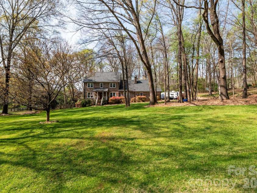 1015 Quail Circle, Salisbury, NC 28147.  MLS# CAR4327821, YatesRealty ID 25358. Flat front yard with Firepit