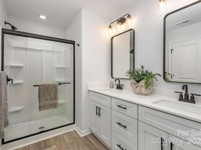 2008 Sadler Woods Lane, Charlotte, NC 28214.  MLS# CAR4233955, YatesRealty ID 2536. Framed shower. Representative Photo