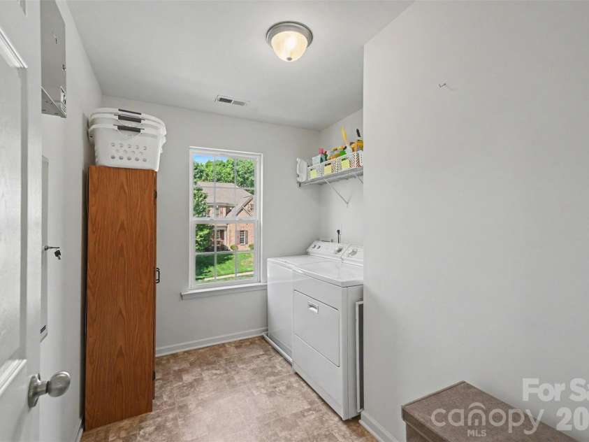 9107 Kensington Forest Drive, Harrisburg, NC 28075.  MLS# CAR4377399, YatesRealty ID 25360. Laundry Room conveniently located on the Second Floor