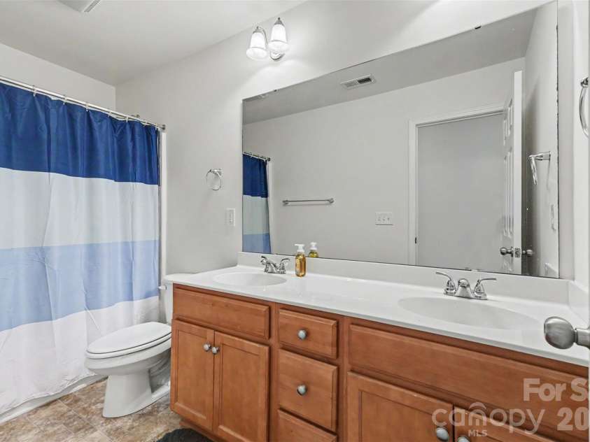 9107 Kensington Forest Drive, Harrisburg, NC 28075.  MLS# CAR4377399, YatesRealty ID 25360. Second Full Bath on the Second Floor