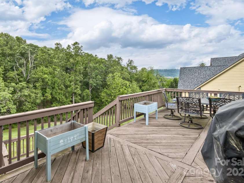33 Stone House Road, Arden, NC 28704.  MLS# CAR4261250, YatesRealty ID 25362. Back deck off great room with an expansive and private view