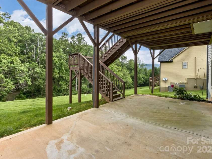 33 Stone House Road, Arden, NC 28704.  MLS# CAR4261250, YatesRealty ID 25362. Back yard off the basement great room.