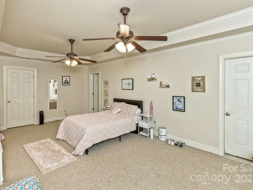 33 Stone House Road, Arden, NC 28704.  MLS# CAR4261250, YatesRealty ID 25362. Downstairs private bedroom, office or playroom with en suite full bath and access to HUGH storage areas