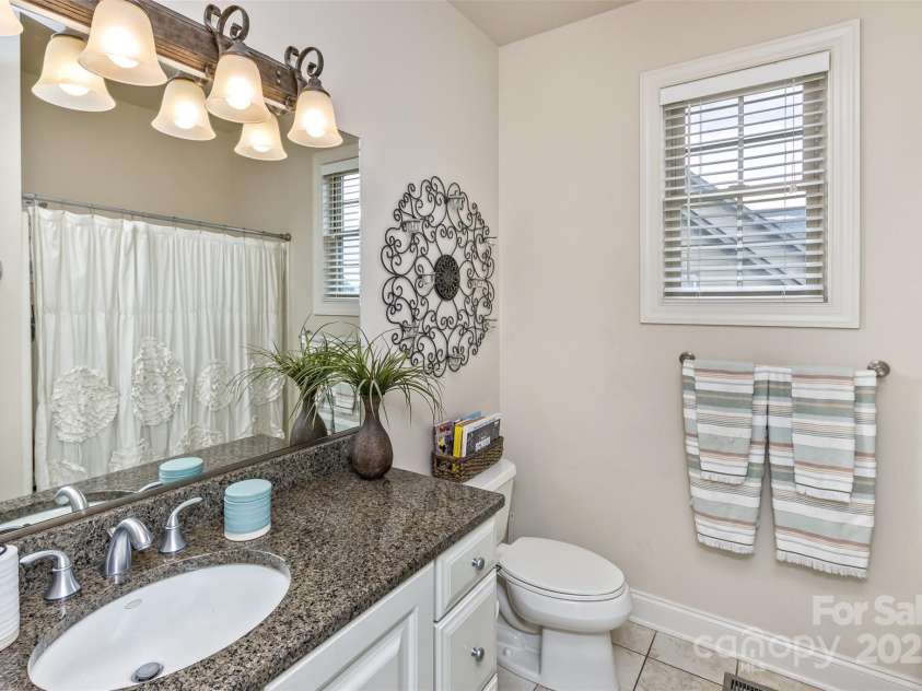 33 Stone House Road, Arden, NC 28704.  MLS# CAR4261250, YatesRealty ID 25362. Guest bath on main floor for bedrooms 2 and 3