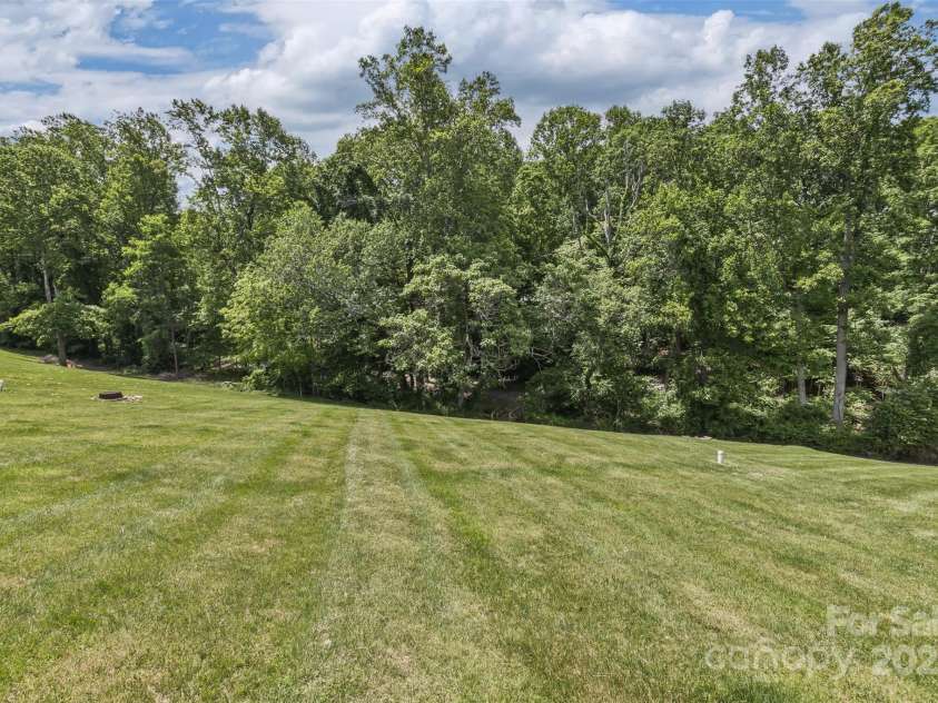 33 Stone House Road, Arden, NC 28704.  MLS# CAR4261250, YatesRealty ID 25362. Plenty of green space for pets, volley ball, and games