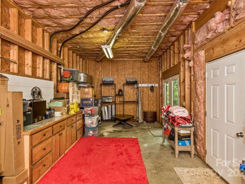 33 Stone House Road, Arden, NC 28704.  MLS# CAR4261250, YatesRealty ID 25362. Storage area with built ins