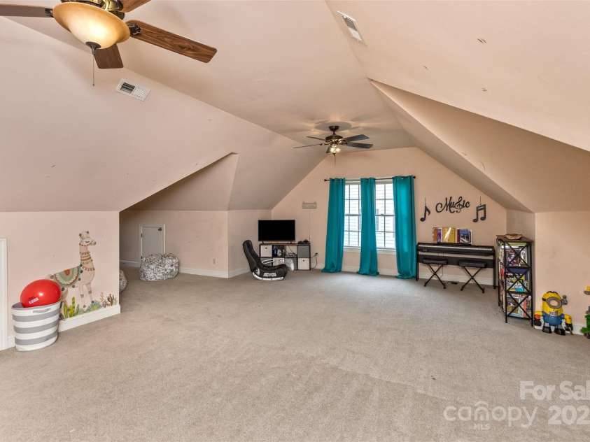 33 Stone House Road, Arden, NC 28704.  MLS# CAR4261250, YatesRealty ID 25362. Upstairs bonus room off the loft