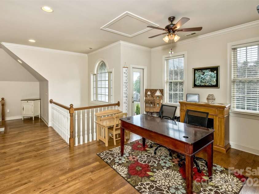 33 Stone House Road, Arden, NC 28704.  MLS# CAR4261250, YatesRealty ID 25362. Upstairs loft for an office or get-away. Adjacent balcony.