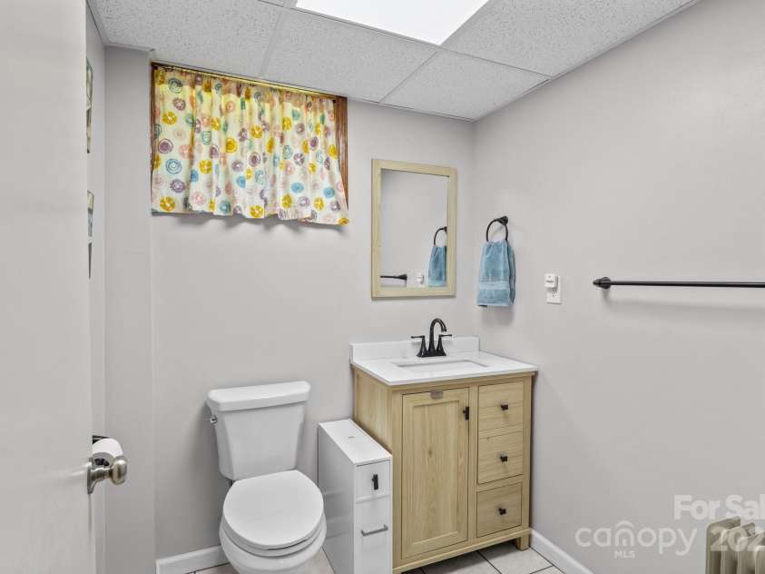 143 Bostian Lake Road, Statesville, NC 28677.  MLS# CAR4275561, YatesRealty ID 25365. 1/2 Bathroom In Basement