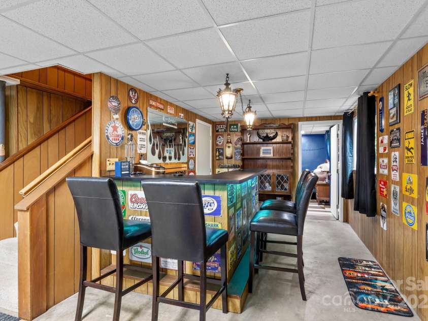 143 Bostian Lake Road, Statesville, NC 28677.  MLS# CAR4275561, YatesRealty ID 25365. Built-In Bar in Basement