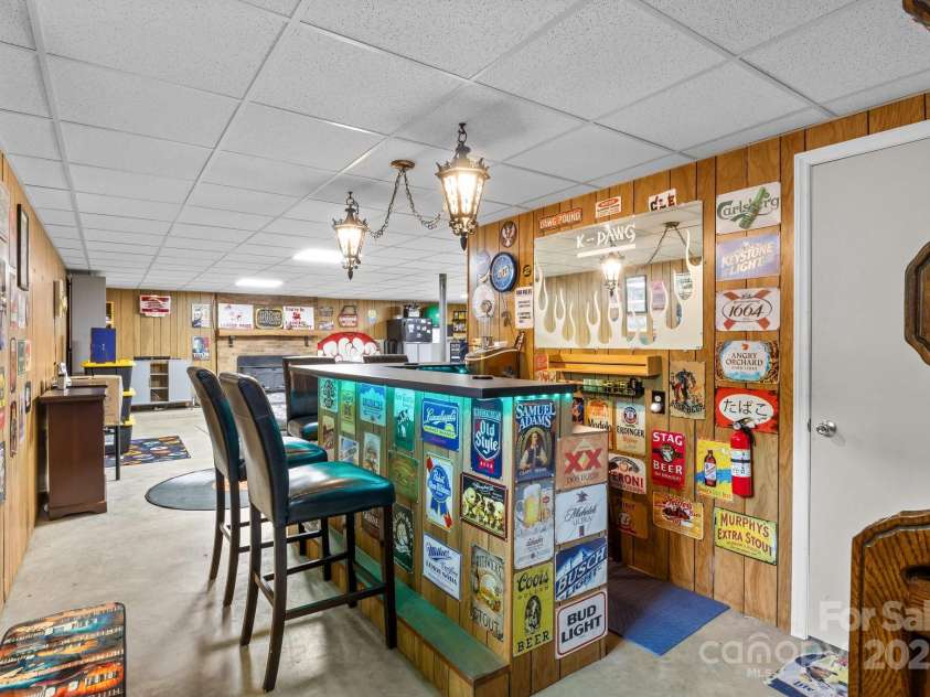 143 Bostian Lake Road, Statesville, NC 28677.  MLS# CAR4275561, YatesRealty ID 25365. Built-In Bar in Basement
