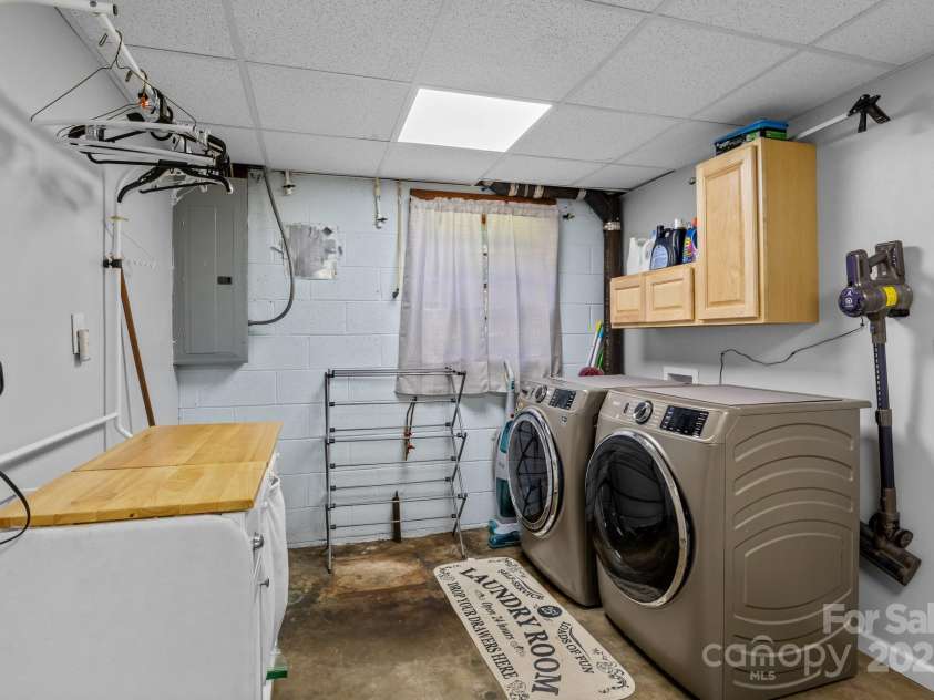 143 Bostian Lake Road, Statesville, NC 28677.  MLS# CAR4275561, YatesRealty ID 25365. Laundry In Basement