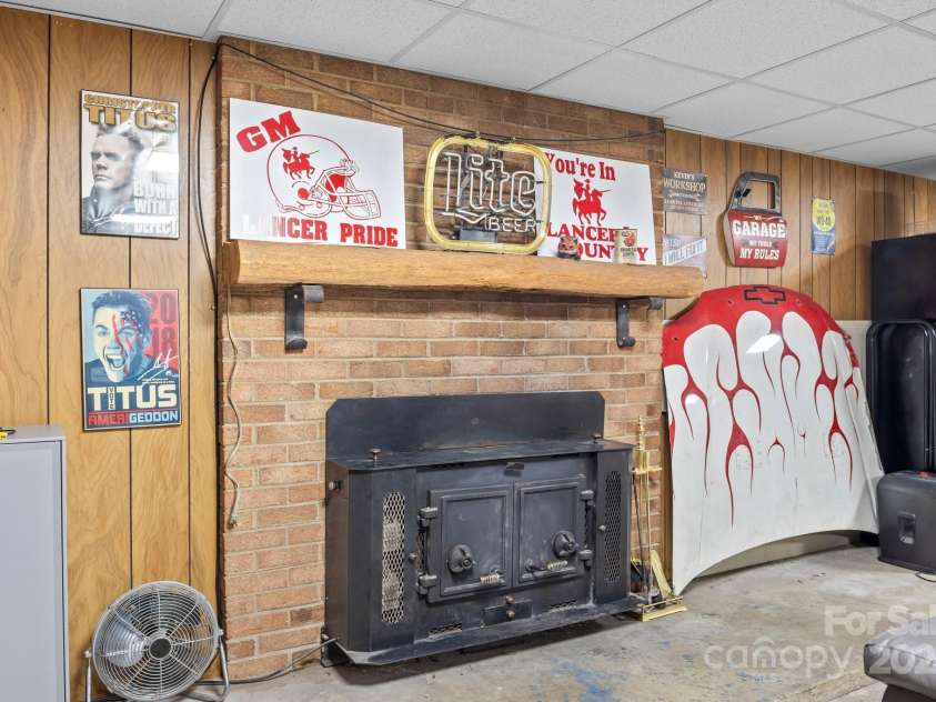 143 Bostian Lake Road, Statesville, NC 28677.  MLS# CAR4275561, YatesRealty ID 25365. Wood Burning Fireplace in Basement