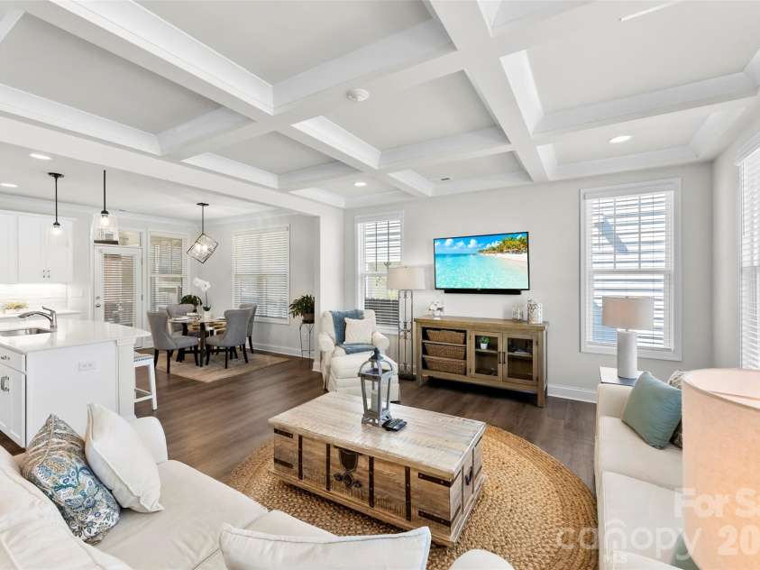 10141 Rainier Trail Drive, Huntersville, NC 28078.  MLS# CAR4375749, YatesRealty ID 25370. Open Floor Plan perfect for entertaining.  Upgraded coffered ceilings add to the luxury of this space.  Upgraded lighting and flooring.  Lots of windows for natural lighting.  Neutral paint throughout.