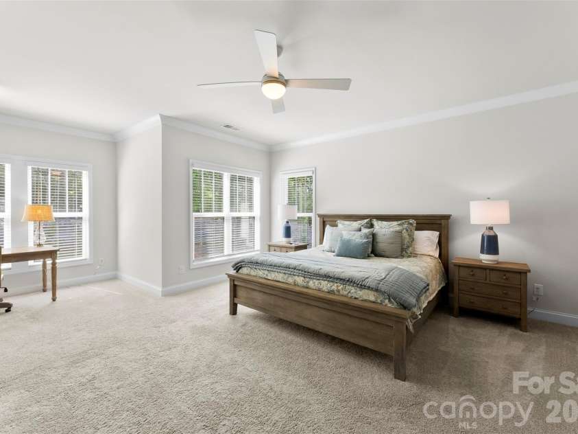 10141 Rainier Trail Drive, Huntersville, NC 28078.  MLS# CAR4375749, YatesRealty ID 25370. This incredible Primary Bedroom Suite offers a thoughtfully designed space perfectly suited for a comfortable sitting area. Imagine relaxing and unwinding in this serene and peaceful retreat after a long day, 