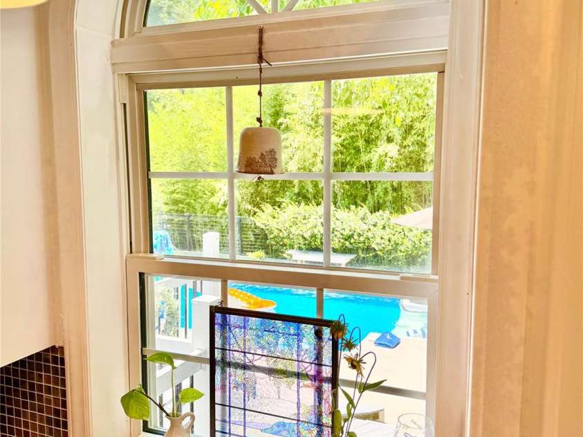 227 Reep Drive, Morganton, NC 28655.  MLS# CAR4312133, YatesRealty ID 25372. Arched window that looks out to the pool