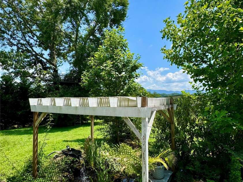 227 Reep Drive, Morganton, NC 28655.  MLS# CAR4312133, YatesRealty ID 25372. Koi pond with pump that stays