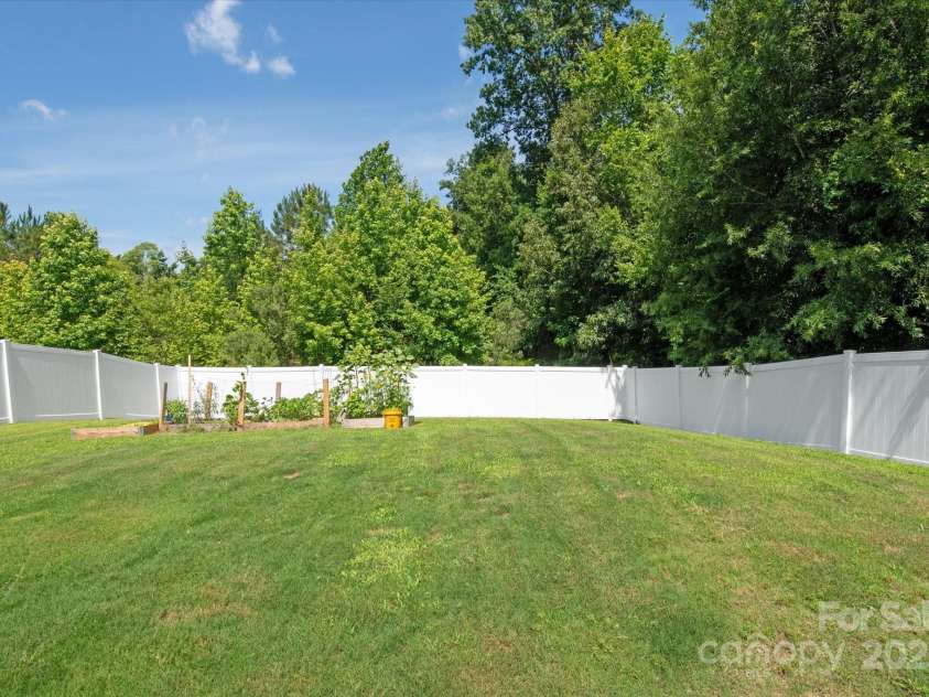 389 Whispering Hills Drive, Locust, NC 28097.  MLS# CAR4273635, YatesRealty ID 25374. Gorgeous garden ready for new owners