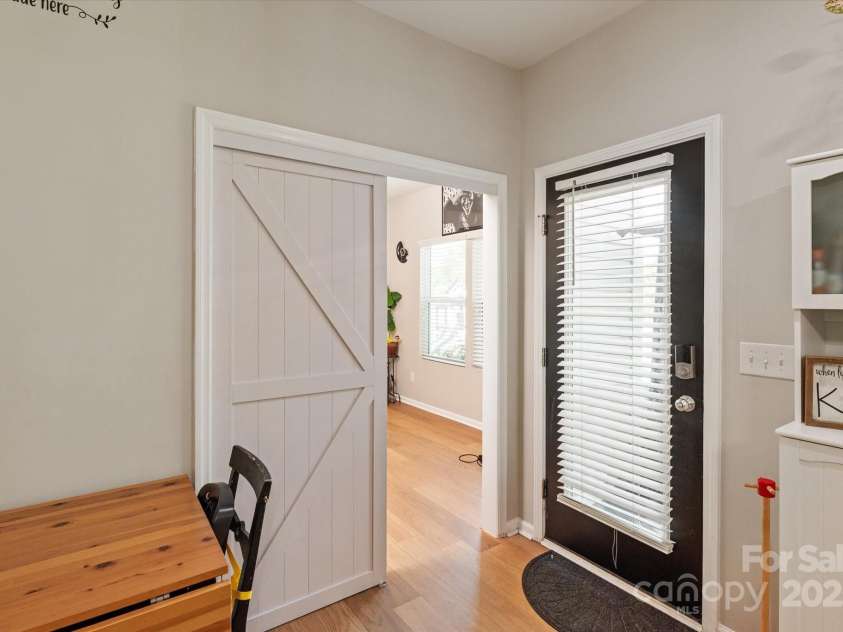 389 Whispering Hills Drive, Locust, NC 28097.  MLS# CAR4273635, YatesRealty ID 25374. New barn door