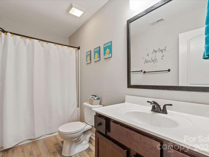 389 Whispering Hills Drive, Locust, NC 28097.  MLS# CAR4273635, YatesRealty ID 25374. One of two full baths