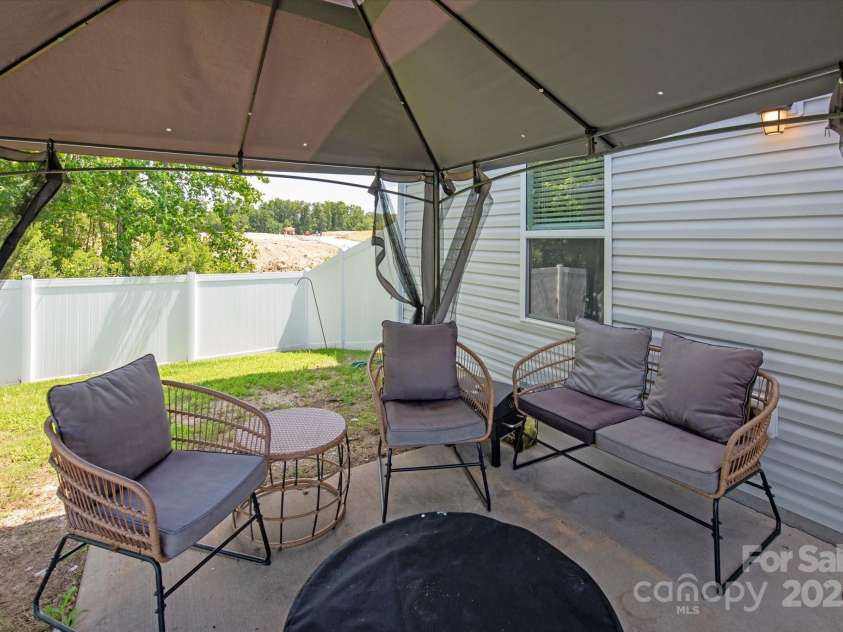 389 Whispering Hills Drive, Locust, NC 28097.  MLS# CAR4273635, YatesRealty ID 25374. Pergola to enjoy the Carolina weather