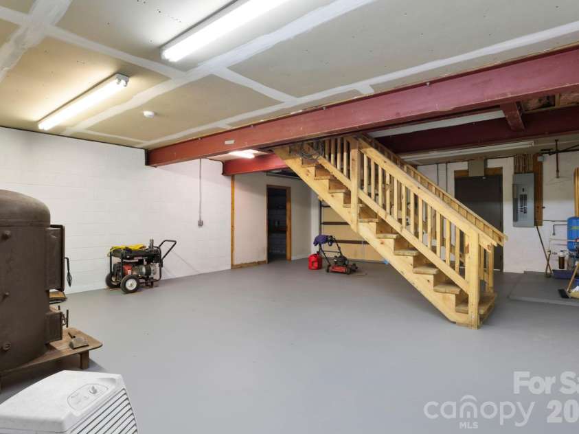 5 Rustic Ridge Drive, Candler, NC 28715.  MLS# CAR4379747, YatesRealty ID 25379. Basement/garage