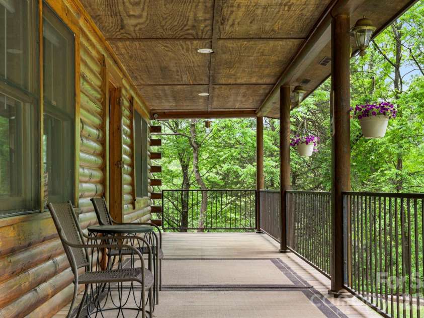 5 Rustic Ridge Drive, Candler, NC 28715.  MLS# CAR4379747, YatesRealty ID 25379. Covered front porch