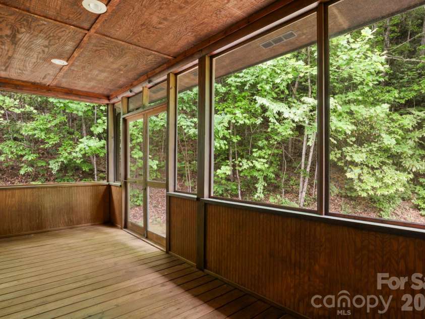 5 Rustic Ridge Drive, Candler, NC 28715.  MLS# CAR4379747, YatesRealty ID 25379. Screened rear porch