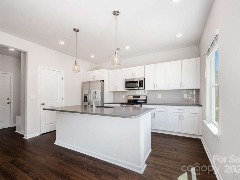3001 Sadler Woods Lane, Charlotte, NC 28214.  MLS# CAR4272760, YatesRealty ID 25380. Kitchen w/ soft-close cabinets. Representational Photo.