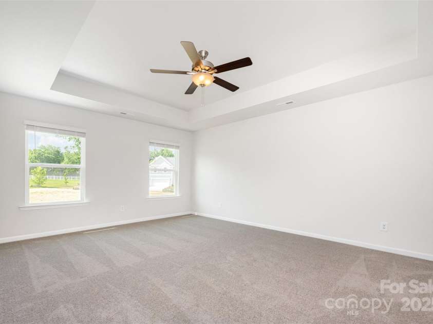 3001 Sadler Woods Lane, Charlotte, NC 28214.  MLS# CAR4272760, YatesRealty ID 25380. Primary bedroom w/ tray ceiling. Representational Photo.