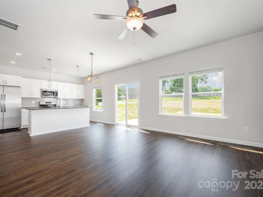 3001 Sadler Woods Lane, Charlotte, NC 28214.  MLS# CAR4272760, YatesRealty ID 25380. SPC flooring throughout. Representational Photo.