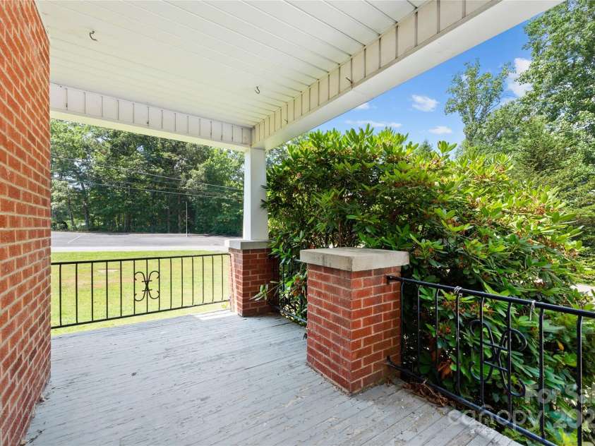 888 Monte Vista Road, Candler, NC 28715.  MLS# CAR4280575, YatesRealty ID 25386. Covered Side Porch