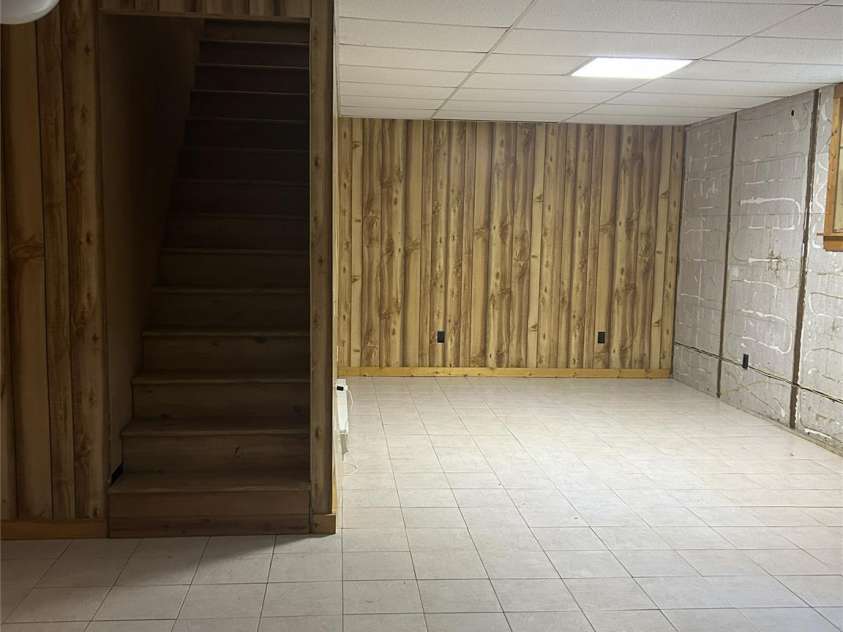 2051 Sutton Spring Road, York, SC 29745.  MLS# CAR4383938, YatesRealty ID 25388. Unfinished basement and stairs