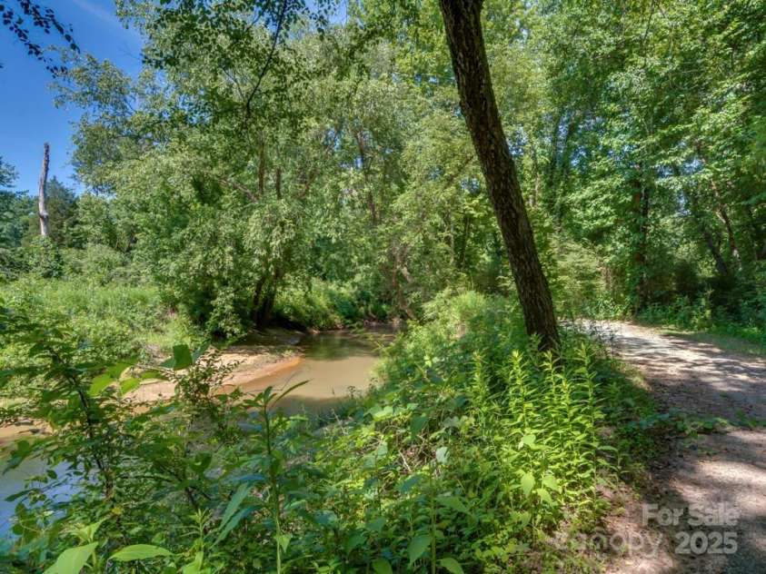 60 Bridge Lane, Tryon, NC 28782.  MLS# CAR4280439, YatesRealty ID 25389. Common Area trails