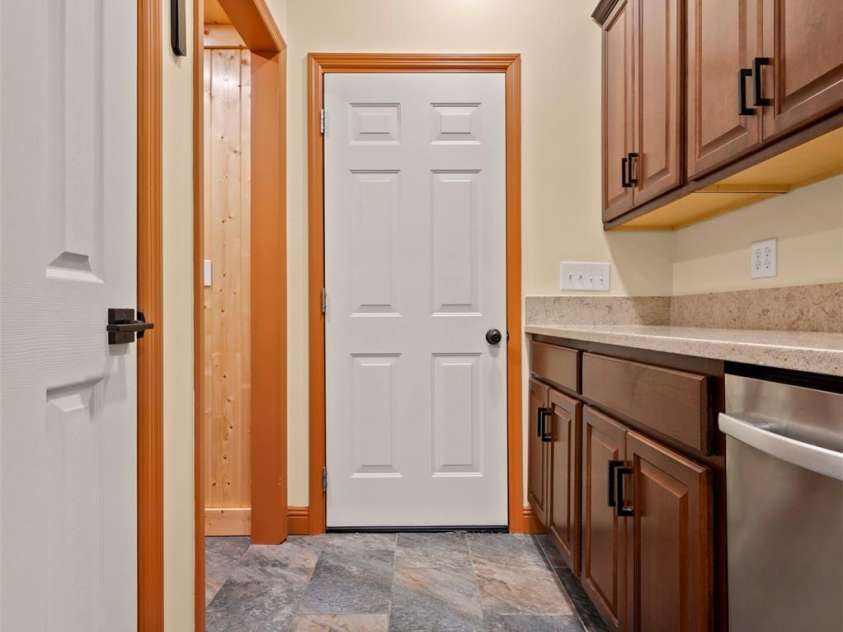 60 Bridge Lane, Tryon, NC 28782.  MLS# CAR4280439, YatesRealty ID 25389. Dropzone with built-ins for pantry, storage or laundry.