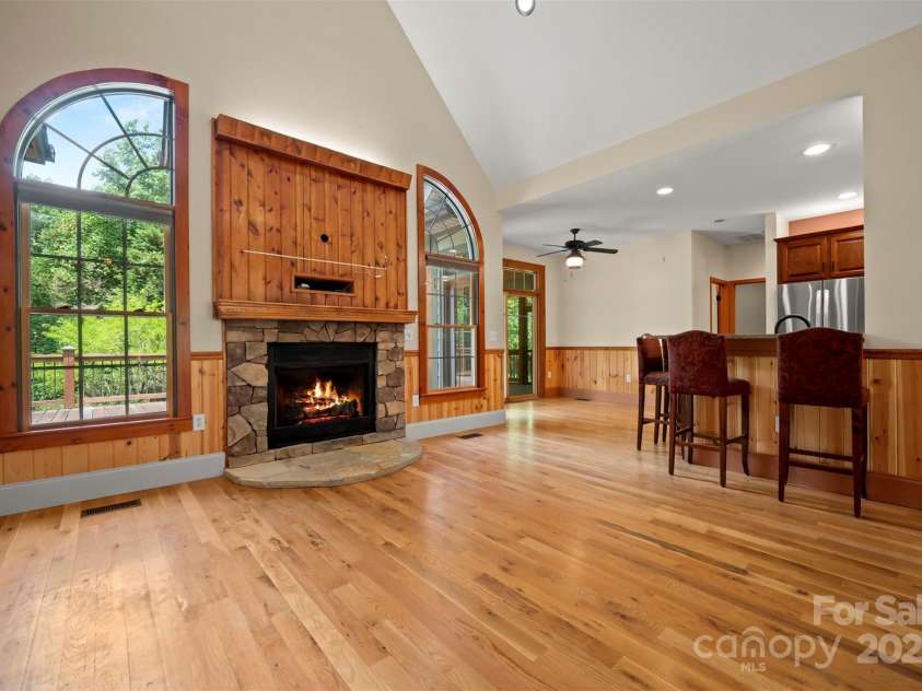 60 Bridge Lane, Tryon, NC 28782.  MLS# CAR4280439, YatesRealty ID 25389. Greatroom Fireplace open to the breakfast area and Kitchen