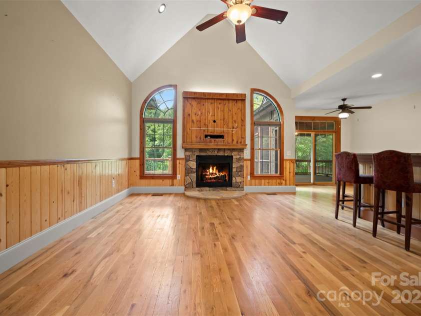 60 Bridge Lane, Tryon, NC 28782.  MLS# CAR4280439, YatesRealty ID 25389. Greatroom with wood flooring and vaulted ceilings