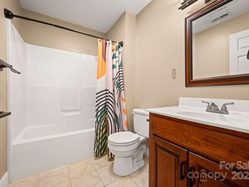 60 Bridge Lane, Tryon, NC 28782.  MLS# CAR4280439, YatesRealty ID 25389. Upper Level Guest Bathroom