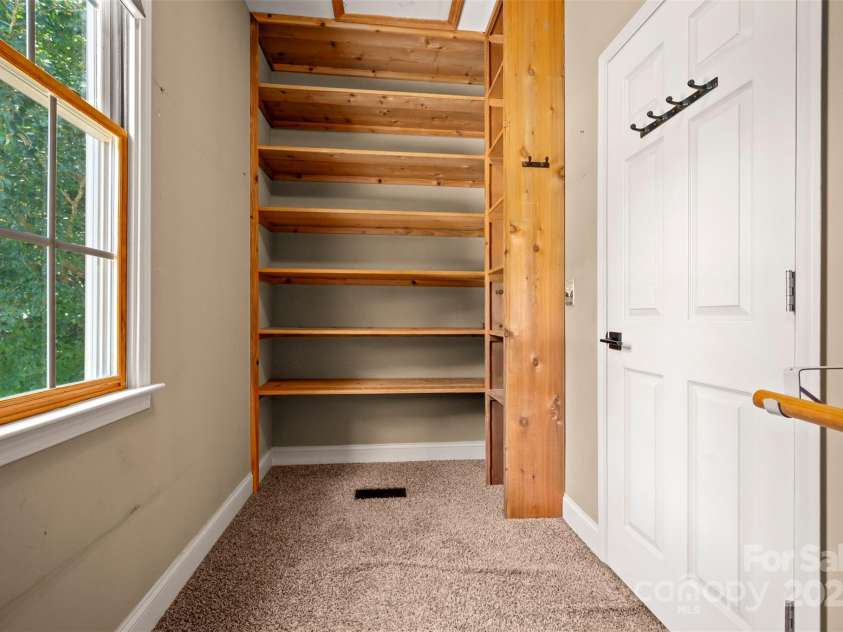 60 Bridge Lane, Tryon, NC 28782.  MLS# CAR4280439, YatesRealty ID 25389. Walk-in Closet wood Shelving