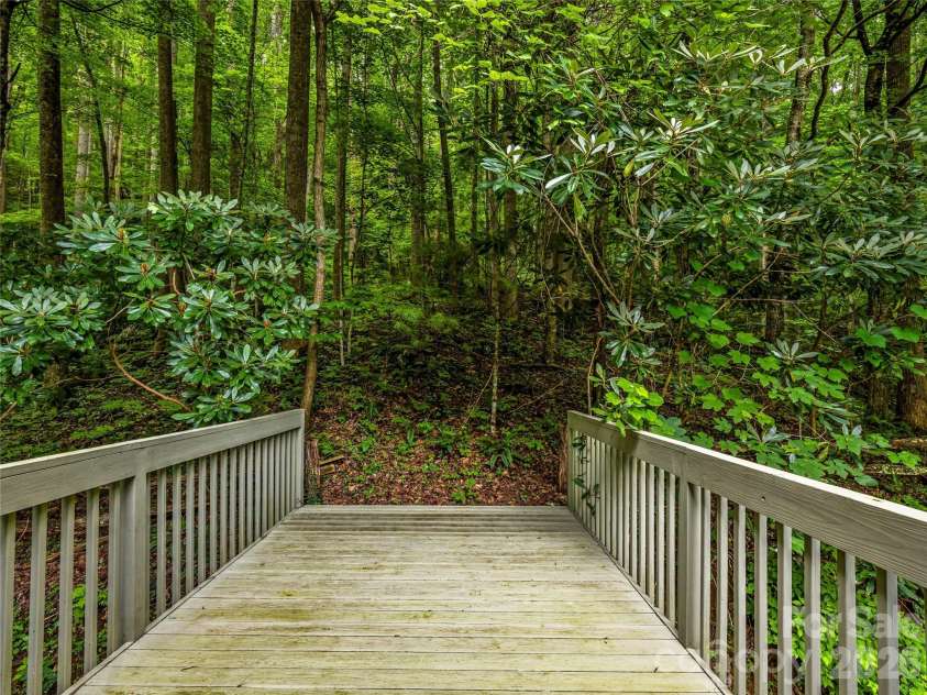 81 Summer Trees Lane, Burnsville, NC 28714.  MLS# CAR4417537, YatesRealty ID 25389. Loft deck enters to the peaceful forest.