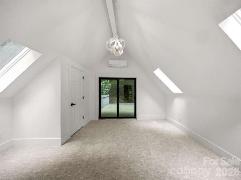 81 Summer Trees Lane, Burnsville, NC 28714.  MLS# CAR4417537, YatesRealty ID 25389. Third floor bedroom, office or artists loft.