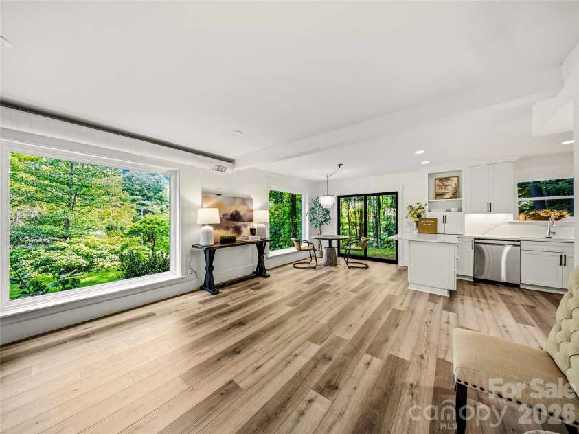 81 Summer Trees Lane, Burnsville, NC 28714.  MLS# CAR4417537, YatesRealty ID 25389. This bright, flexible main-level space offers options for a formal dining room, additional living area, or a combination of both.