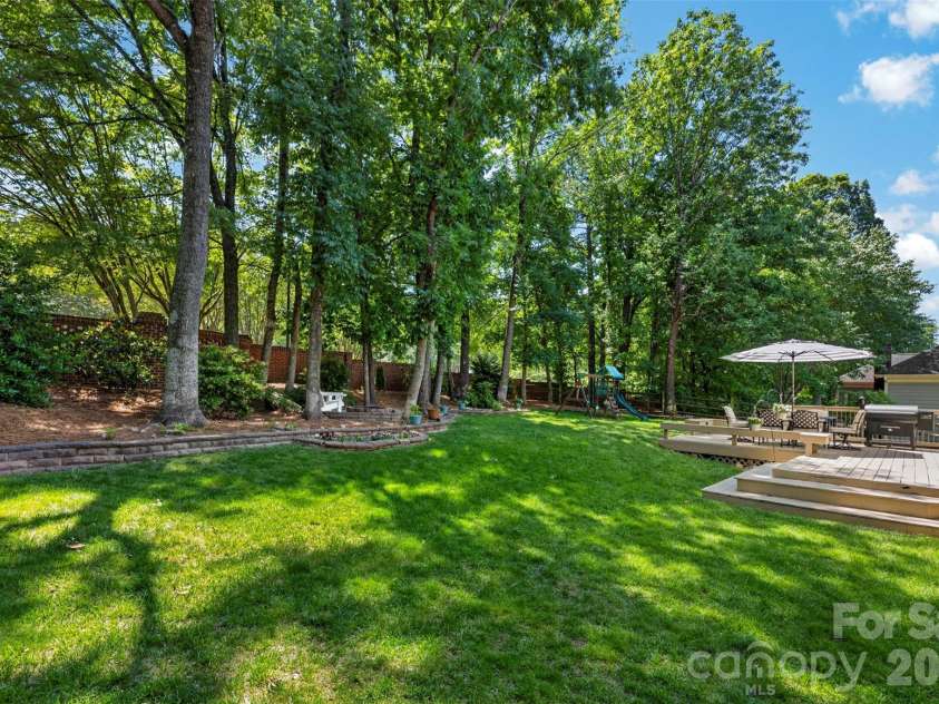 7618 Wingmont Drive, Charlotte, NC 28269.  MLS# CAR4382505, YatesRealty ID 25391. Backyard