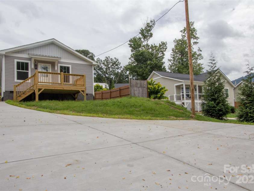 30 Babb Street, Waynesville, NC 28786.  MLS# CAR4280509, YatesRealty ID 25394. New concrete driveway & parking pad below