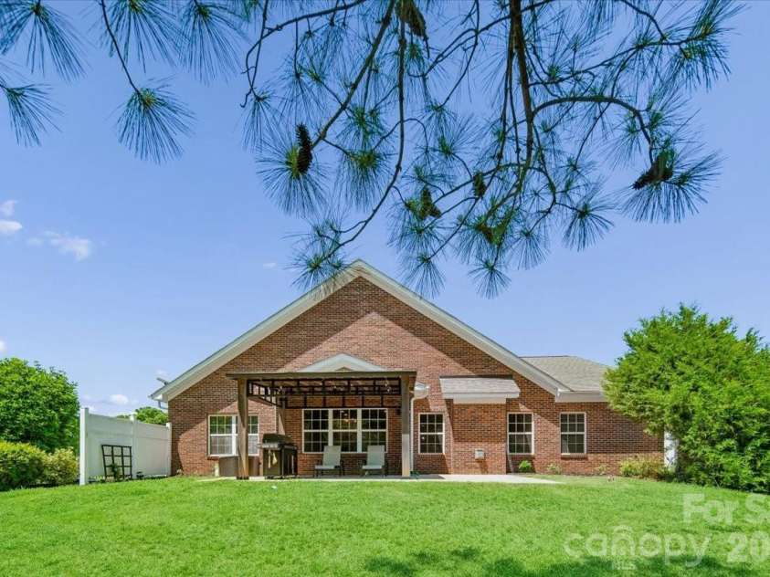 1006 Spring Rose Lane, Matthews, NC 28104.  MLS# CAR4382311, YatesRealty ID 25396. Backyard