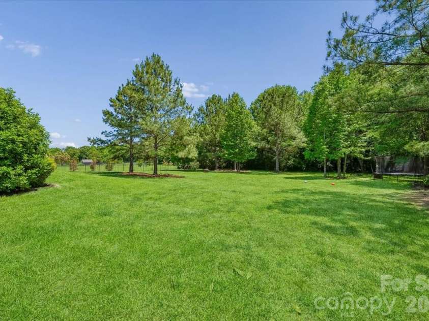 1006 Spring Rose Lane, Matthews, NC 28104.  MLS# CAR4382311, YatesRealty ID 25396. Backyard