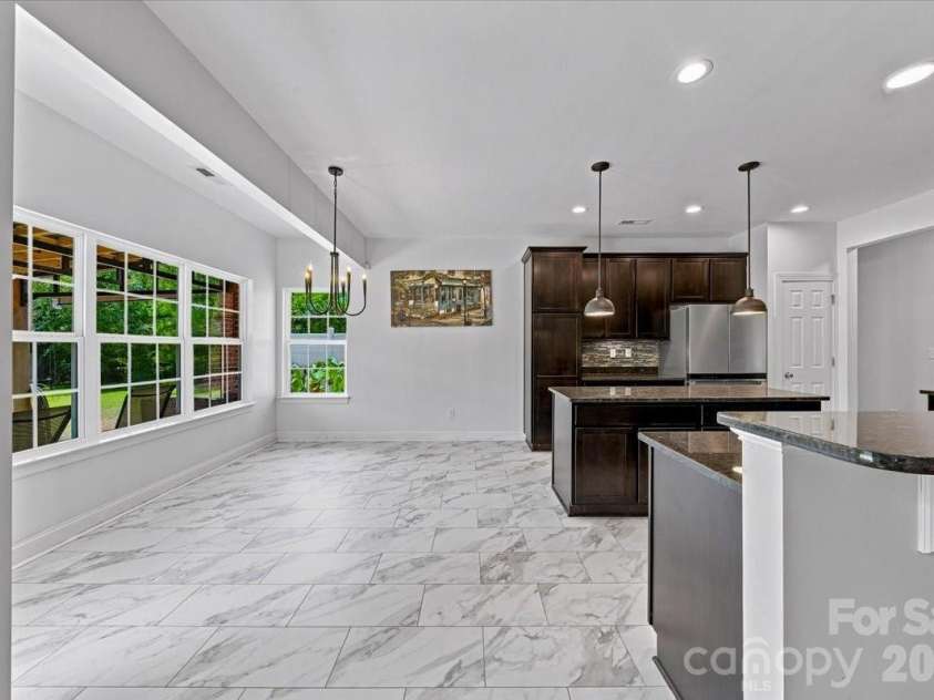 1006 Spring Rose Lane, Matthews, NC 28104.  MLS# CAR4382311, YatesRealty ID 25396. Breakfast Area *new flooring*
